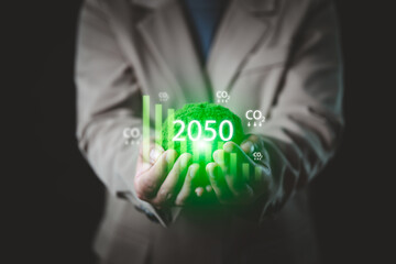 Image of a businessman showing a virtual screen showing the use of clean energy, 3R, reuse, reduce,...