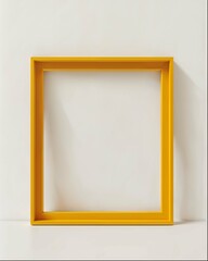 A yellow frame with rounded corners stood on the floor against an empty white wall. The frame was simple and minimalistic in design, featuring straight edges without any decorative elements or pattern