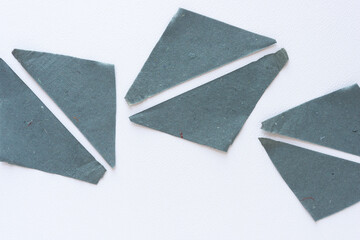 squares composed of two triangle shapes on blank paper