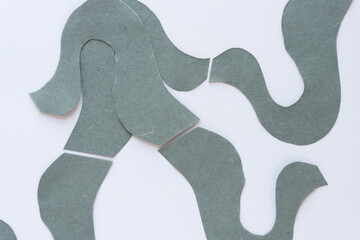 elegant wavy cut paper shapes on blank paper