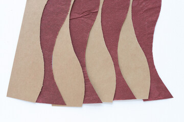 brown and red paper pattern with repeating wavy element