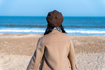Contemplative Woman Gazing at the Ocean - 771578960