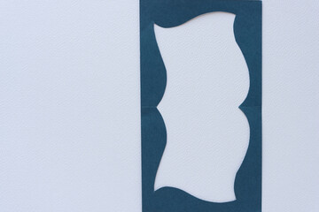 blue paper frame with elegant wavy edges 