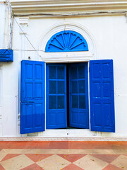 Traditional vintage Blue open door of white haveli of rajasthan