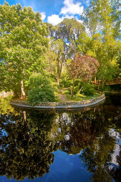 Beautiful reflections of trees in a lake in the Parque de la Quinta de la Fuente del Berro in Madrid &ndash; Spain - Europe