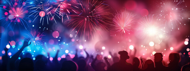 Obraz na płótnie Canvas Fireworks Display Over Crowd at Night