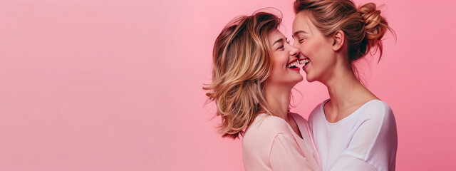 Joyful Mothers and Daughters in Loving Embrace with Pink Background