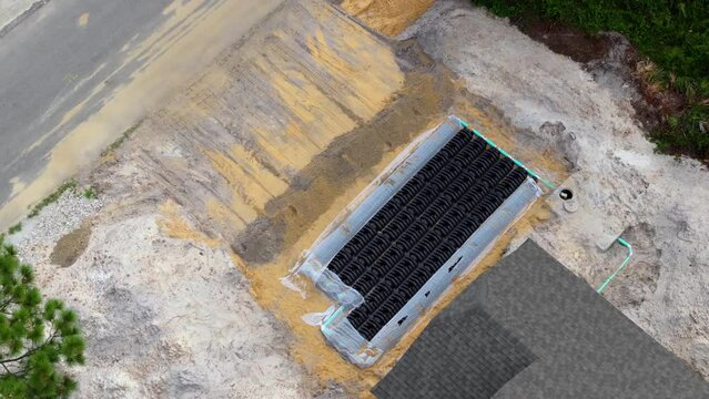 Septic drain field installation on yard ground works at residential private home under construction in Florida quiet rural area. Real estate development concept