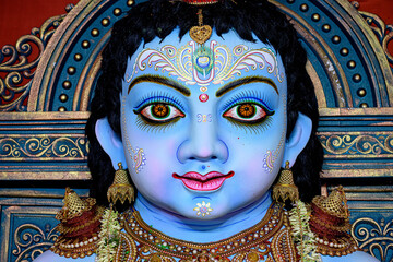 Idol of Goddess Laddu Gopal or little Lord Krishna at a decorated puja pandal in Kolkata, West...