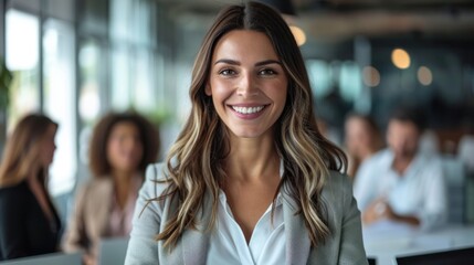Smiling confident business leader looking at camera and standing in an office at team meeting Portrait of confident businesswoman with colleagues in boardroom Using digital tablet during a meeting