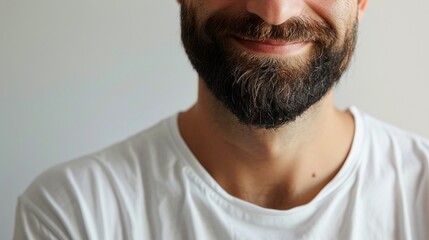 Obraz premium Contrast of Emotion Depict the smile man in a white tshirt, eye focus front against on gray background,handsome,soft shadows ,high detailed , hyper realistic