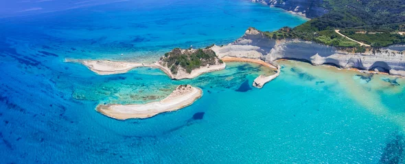 Fototapeten Ionian islands of Greece Corfu. Panoramic aerial view of stunning Cape Drastis - natural beuty landscape with white rocks and turquoise waters, north of the island © Freesurf