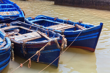 Famous fishing wooden blue boats of the Essaouira on a summer sunny day. Morocco.