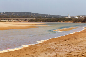 View of the shallow river among african sandy landscape near Essaouira, Morocco.