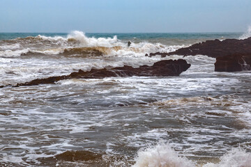 View of the volcanic shore of the Atlantic Ocean in the area of Essaouira in Morocco.