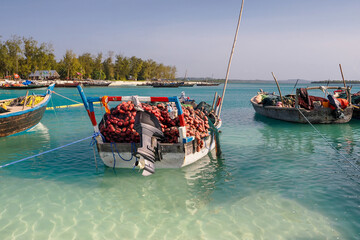 Fishing boats with nets on board waiting to go out and catch fish. Zanzibar Kendwa beach	