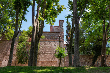 View of the ancient bricks walls in the Gulhane Park near the famous Topkapi Palace. Istanbul, Turkey.