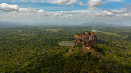 Fototapeta na wymiar Aerial drone of the Sigiriya rock among the green jungle on the island of Sri Lanka.