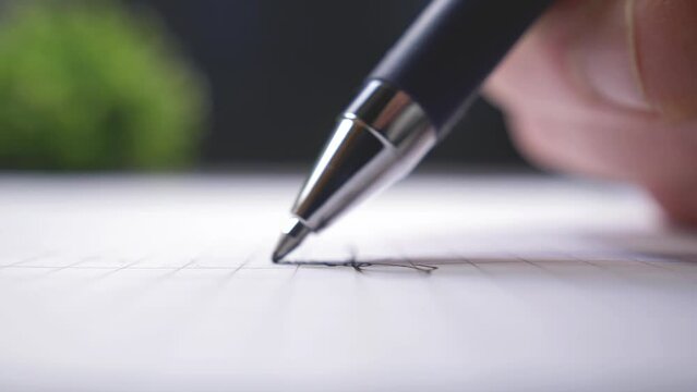 Sign a paper document with ball pen, extreme close-up shot