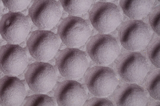 Texture of empty cardboard box for big passionate eggs or fruits. Recycled egg carton box background.