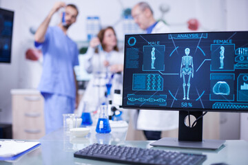 Display monitor in a hospital laboratory showing human skeleton - obrazy, fototapety, plakaty