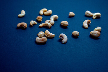 Fototapeta na wymiar nuts on a plain background, cashew nuts a mix of nuts