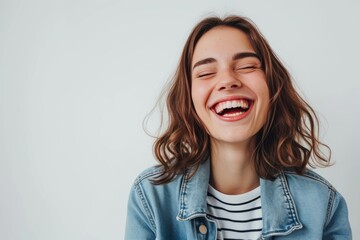 Pretty Young Woman in Striped T-shirt and Denim Jacket, Laughing photo on white isolated background - Powered by Adobe