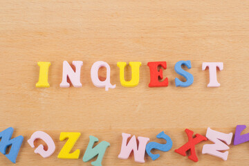 INGUEST word on wooden background composed from colorful abc alphabet block wooden letters, copy space for ad text. Learning english concept.