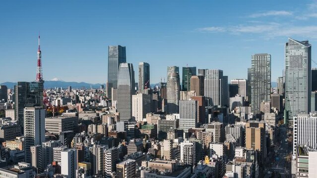 Timelapse view of skyscrapers in the Minato City on a sunny day in Tokyo, Japan.