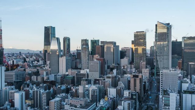 Timelapse view of skyscrapers in Minato City at sunrise, Central Tokyo, Japan.