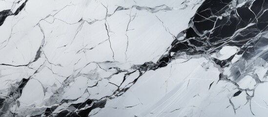 A detailed closeup of a black and white marble texture, resembling a winter landscape with fluid...