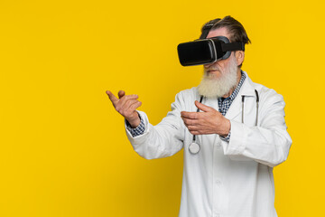 Excited senior doctor cardiologist man using headset helmet app watching virtual reality 3D 360...