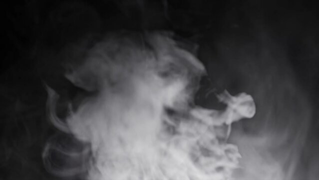 background of white smoke in the dark