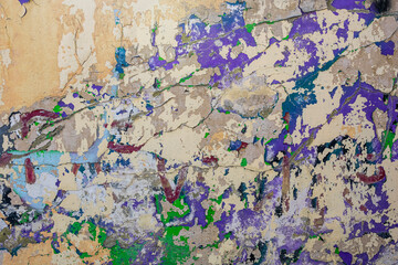 Abstract multicolor grunge background with abstract color texture. Abstraction from collapsing graffiti on the wall. Weathered wall background