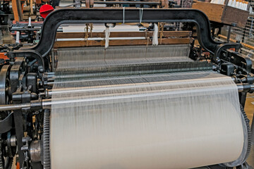 Vintage industrial background featuring detail of traditional weaving machine in Japan.
