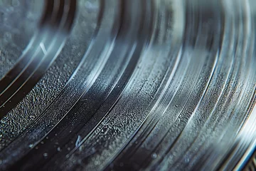 Muurstickers : A detailed shot of a vinyl record, with contrasting textures of smooth grooves and rough, scratched surfaces, © crescent