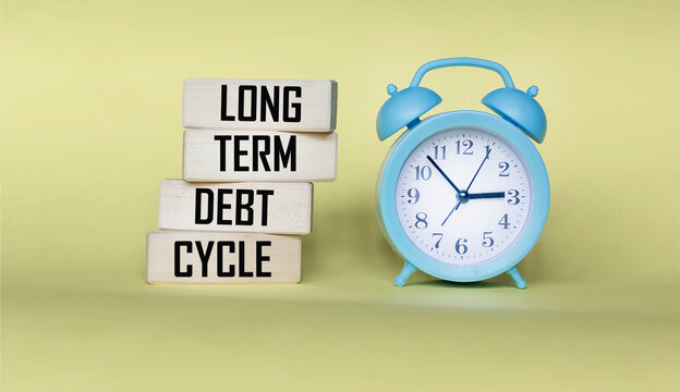 Long term debt cycle symbol. Long term debt cycle on wooden blocks.