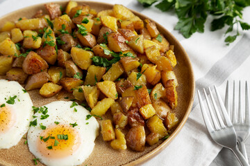 Homemade Garlic Herb Roasted Potatoes on a Plate, side view.