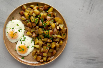 Homemade Garlic Herb Roasted Potatoes on a Plate, top view. Copy space.