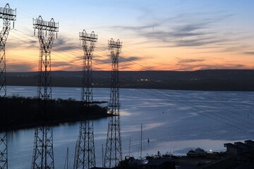 View of the bay from the bridge and power lines against the sunset in the city of Varna (Bulgaria)