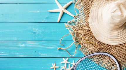 summer outdoor activity background.beach hat, starfish and beach badminton racket on wooden background. free space for design