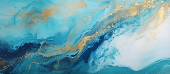 Closeup of a fluid painting with electric blue and gold marbling, resembling a natural landscape...