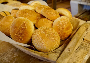 A batch of sesame seed buns freshly baked and ready for serving.