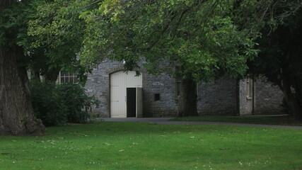 Stone building door in the trees