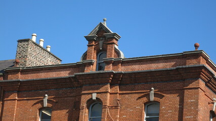 Red brick facade with arches