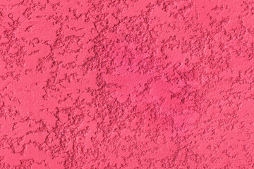 Pink paint rough plaster wall surface solid abstract stucco pattern background texture cement