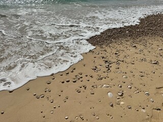 Gentle waves on the fine sand beach.