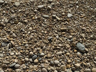 Beach background of smooth rounded stones.