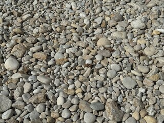 Beach background of smooth rounded stones.