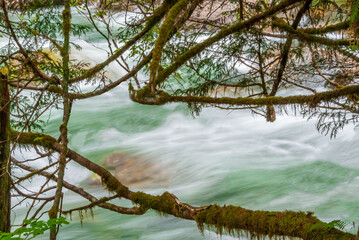 Majestic mountain river long exposure with rocky background in Vancouver, Canada.